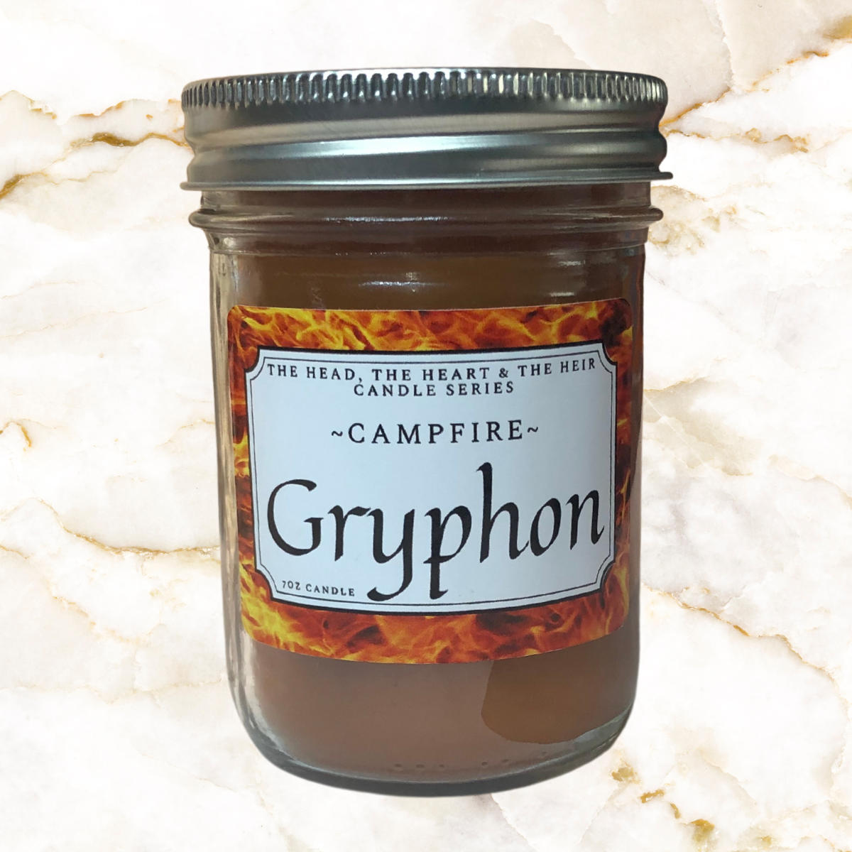 Orange candle in 250 ml mason jar - Label says Gryphon with Campfire smell