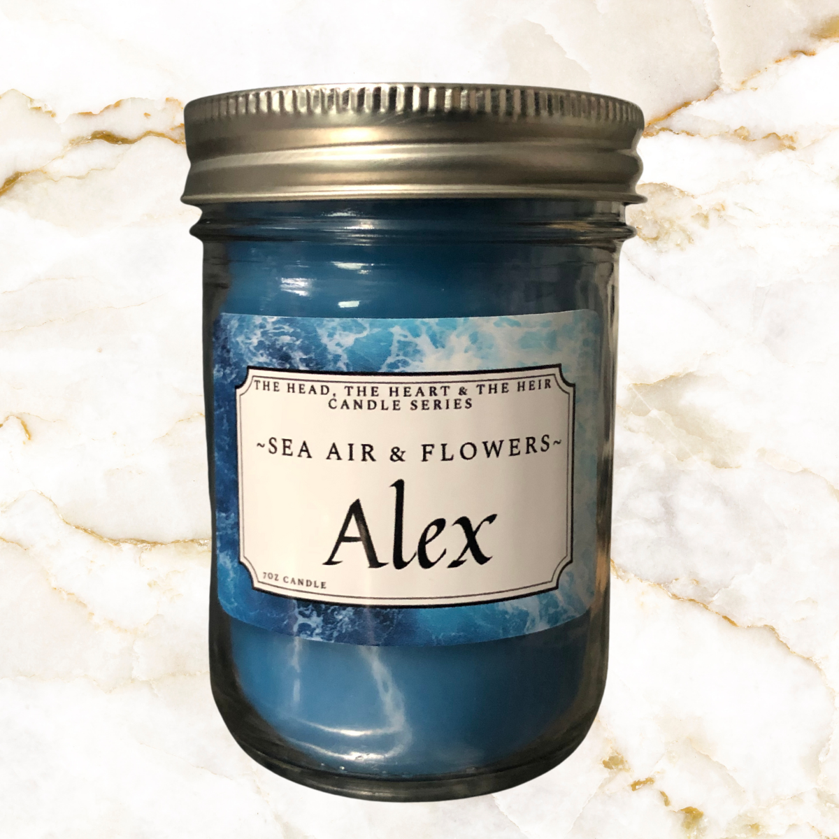 Blue candle in 250 ml mason jar - Label says Alex with Sea Air & Flowers smell
