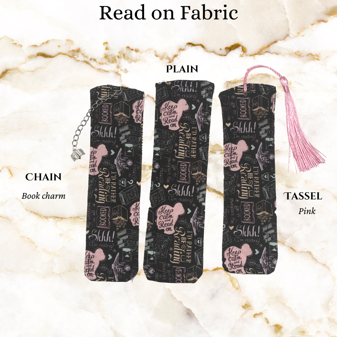 Fabric with pink head books and read notes - 1 plain, 1 with a pink tassel, and 1 with a book charm