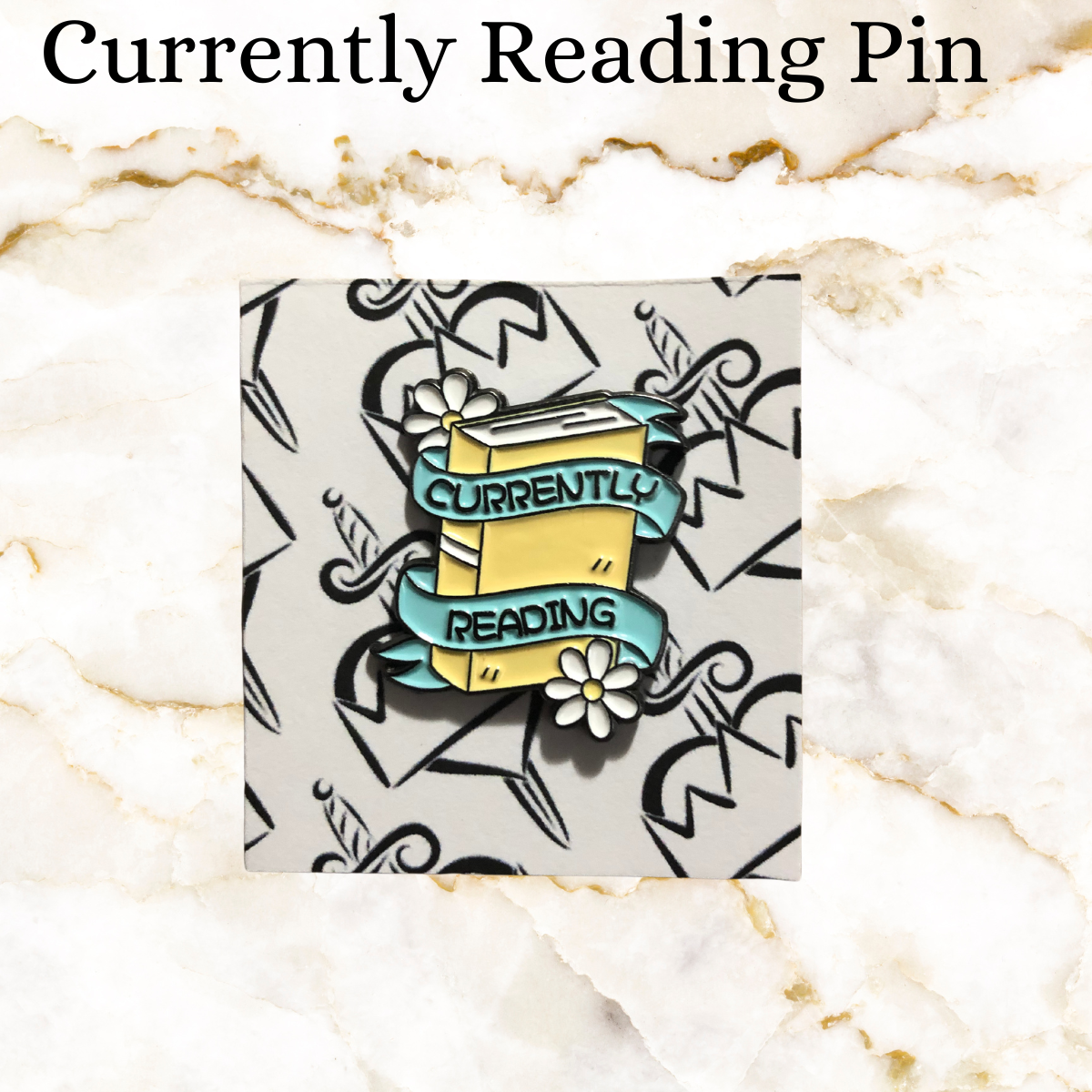 Book pin - Yellow book with white flowers on top and bottom - blue ribbon on front says Currently Reading