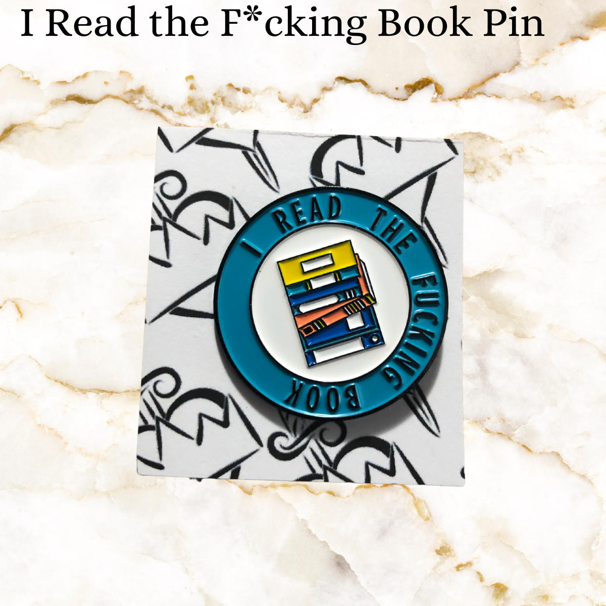 Book pin - blue cirlce. inside a white cirlce with stack of 7 books of blue and yellow and orange. Outside blue circl says I read the Fucking book