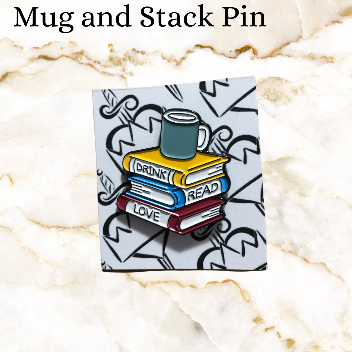 Book pin - stack or 3 books (yellow, blue and red) says Drink Read Love with a green coffee mug on top