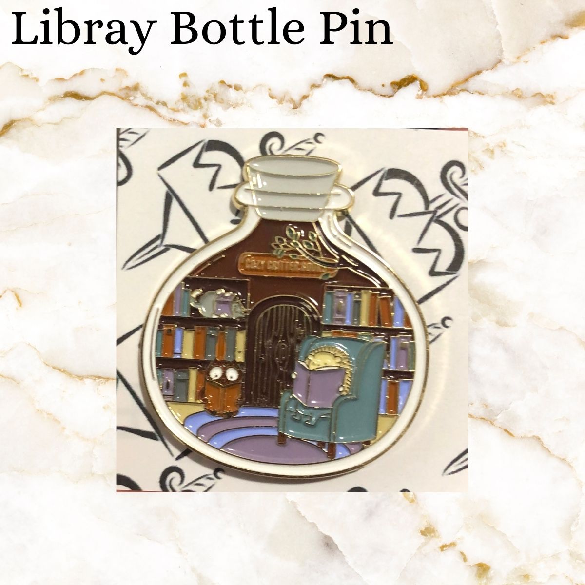 Book pin - a large bottle with a library instead it where a hedgehog and owl are reading books - hedgehog in a chair, owl on the carpet