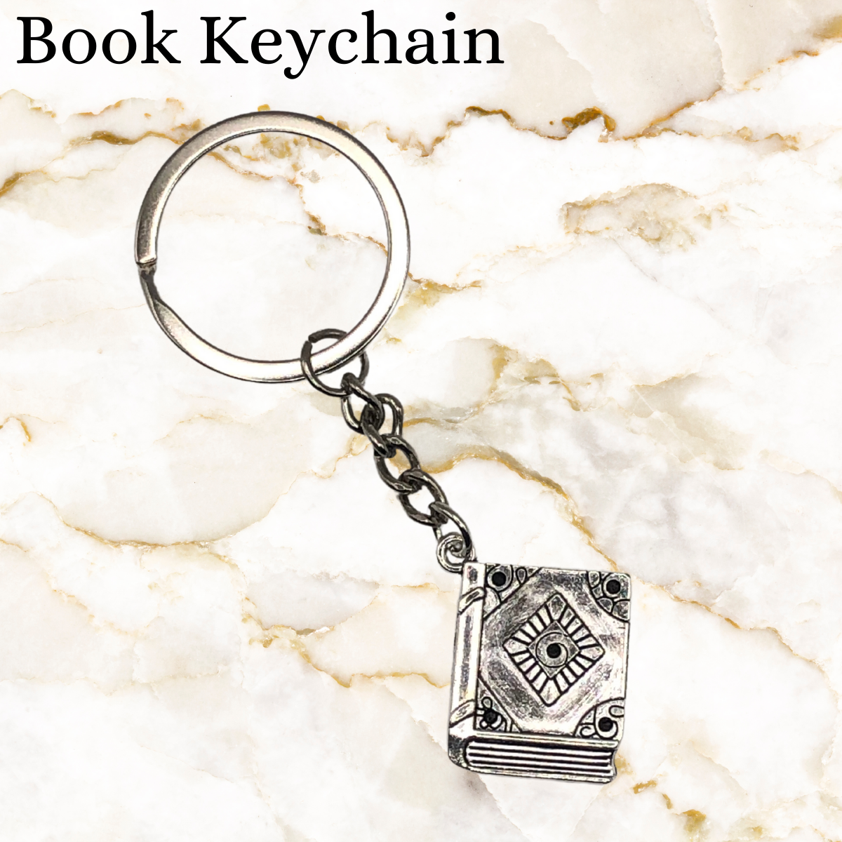 Chrome Keychain with a book on it